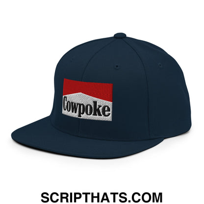 Dark navy blue snapback hat with red and white cowpoke embroidered logo and flat bill brim in black lettering