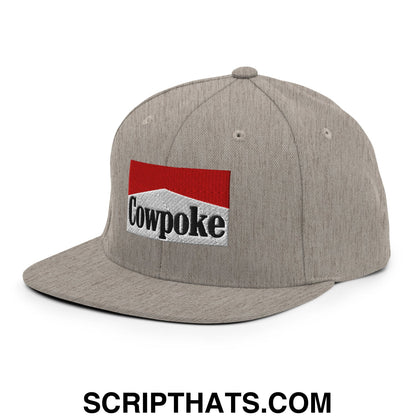 Gray snapback hat with flat bill brim featuring red and white embroidered cowpoke logo with black lettering