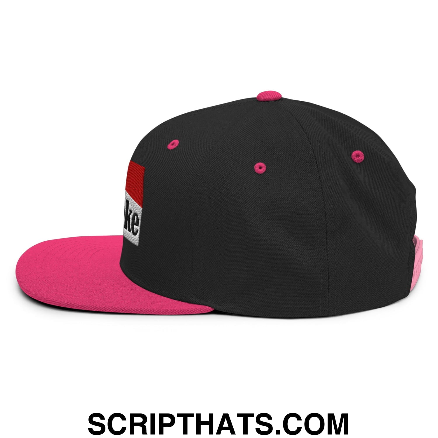 Black and pink cowpoke snapback hat with flat bill brim and red white black embroidered patch on the side