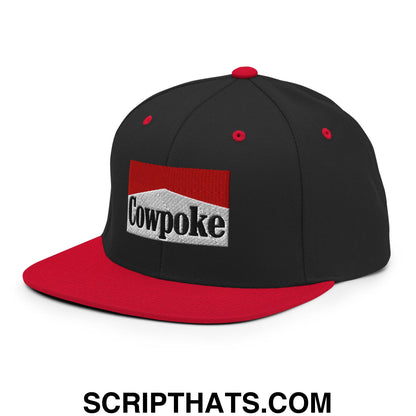 Black and red snapback cowpoke embroidered flat bill brim hat with black logo on white background framed by red rectangle