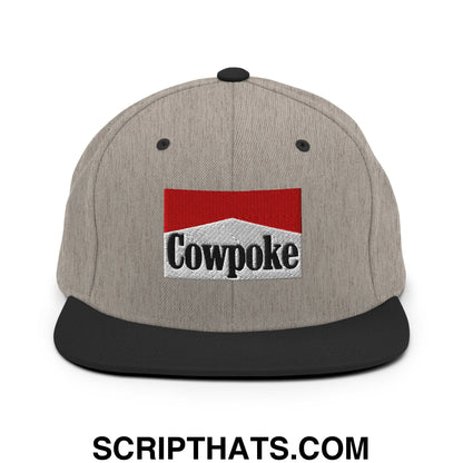 Gray snapback hat with black brim featuring red and white embroidered cowpoke logo on front panel
