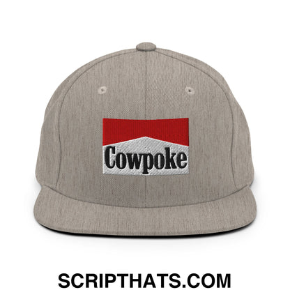 Gray snapback hat with red and white embroidered cowpoke logo and black lettering on a flat bill brim
