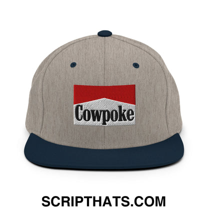 Gray and navy blue snapback hat with flat bill brim featuring an embroidered cowpoke logo in red white and black