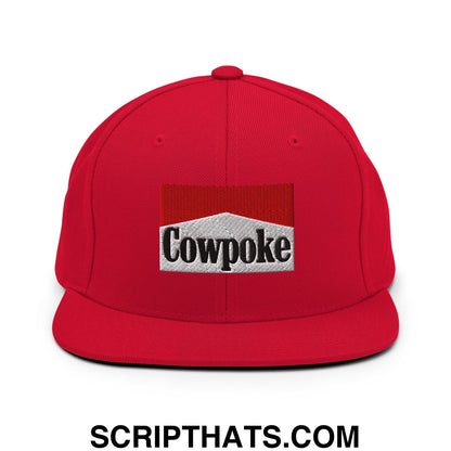 Red snapback cap with a flat bill brim featuring an embroidered cowpoke logo in silver and red design