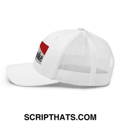 White cowpoke embroidered mesh trucker hat with red and silver embroidered patch on the side