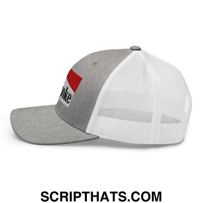 Gray and white mesh trucker hat with red patch embroidered with poke in black lettering cowpoke embroidered style
