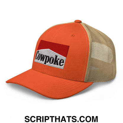 Orange and beige mesh trucker hat with red white and black embroidered cowpoke logo on the front