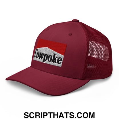 Maroon mesh trucker hat with red and white embroidered cowpoke logo on the front panel
