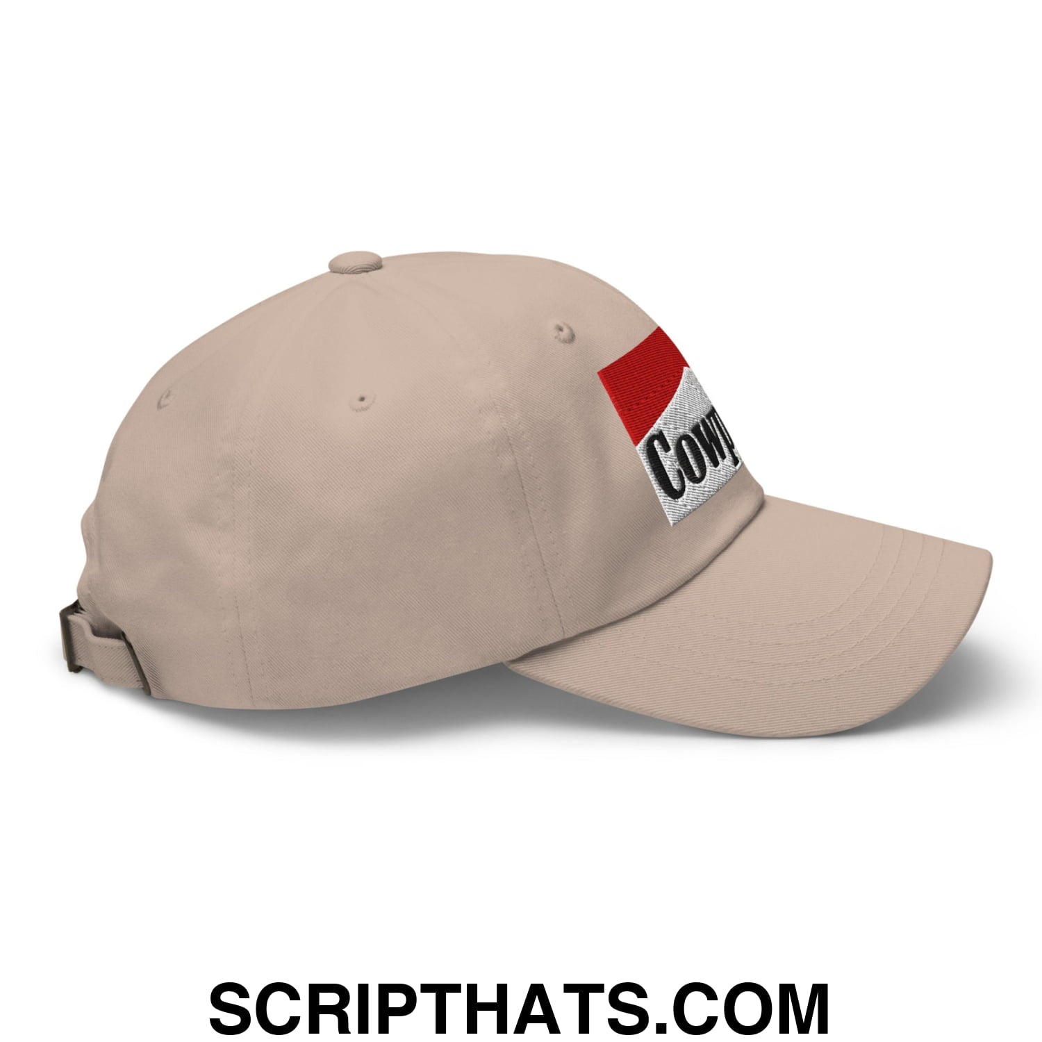 Beige unstructured dad hat with red and white embroidered patch featuring cow in black lettering