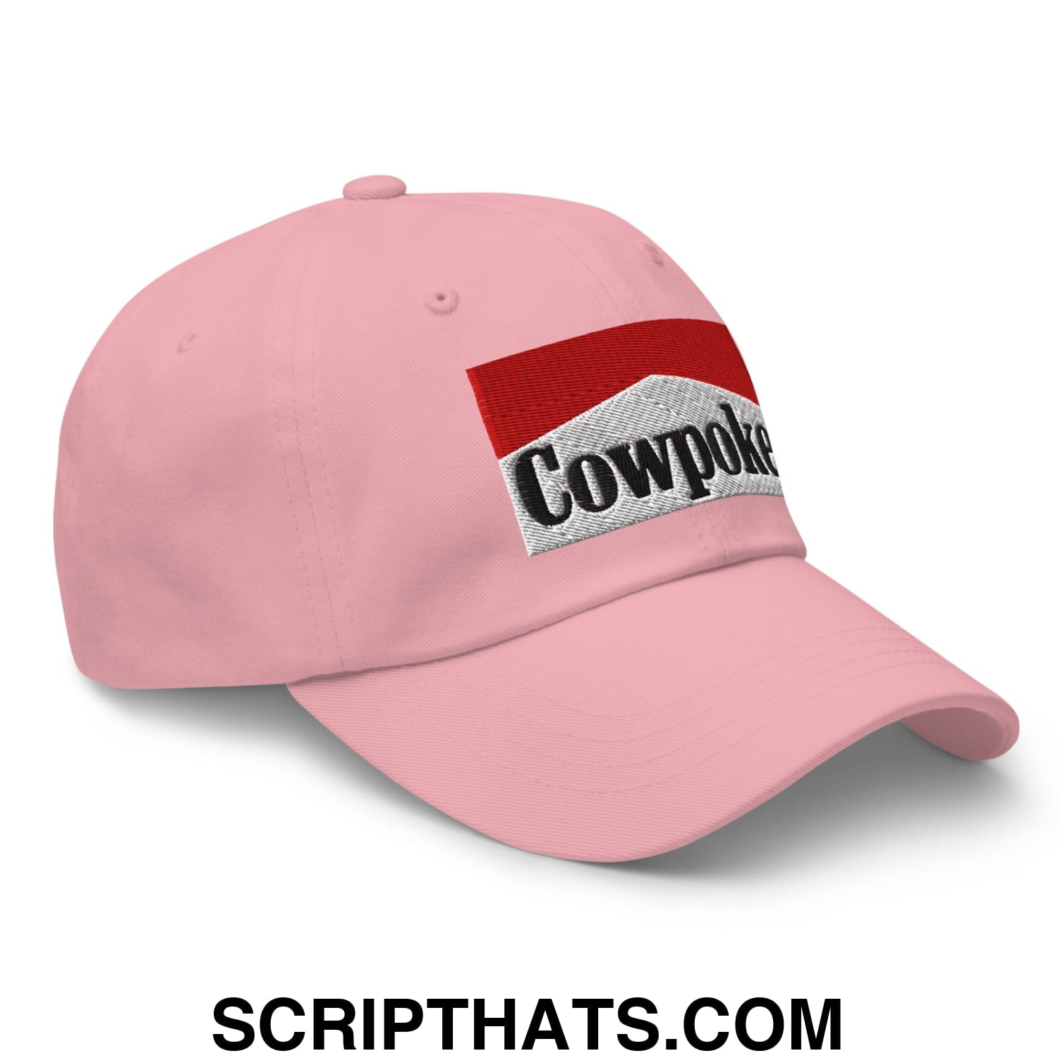 Pink unstructured dad hat featuring an embroidered cowpoke logo in red and silver design