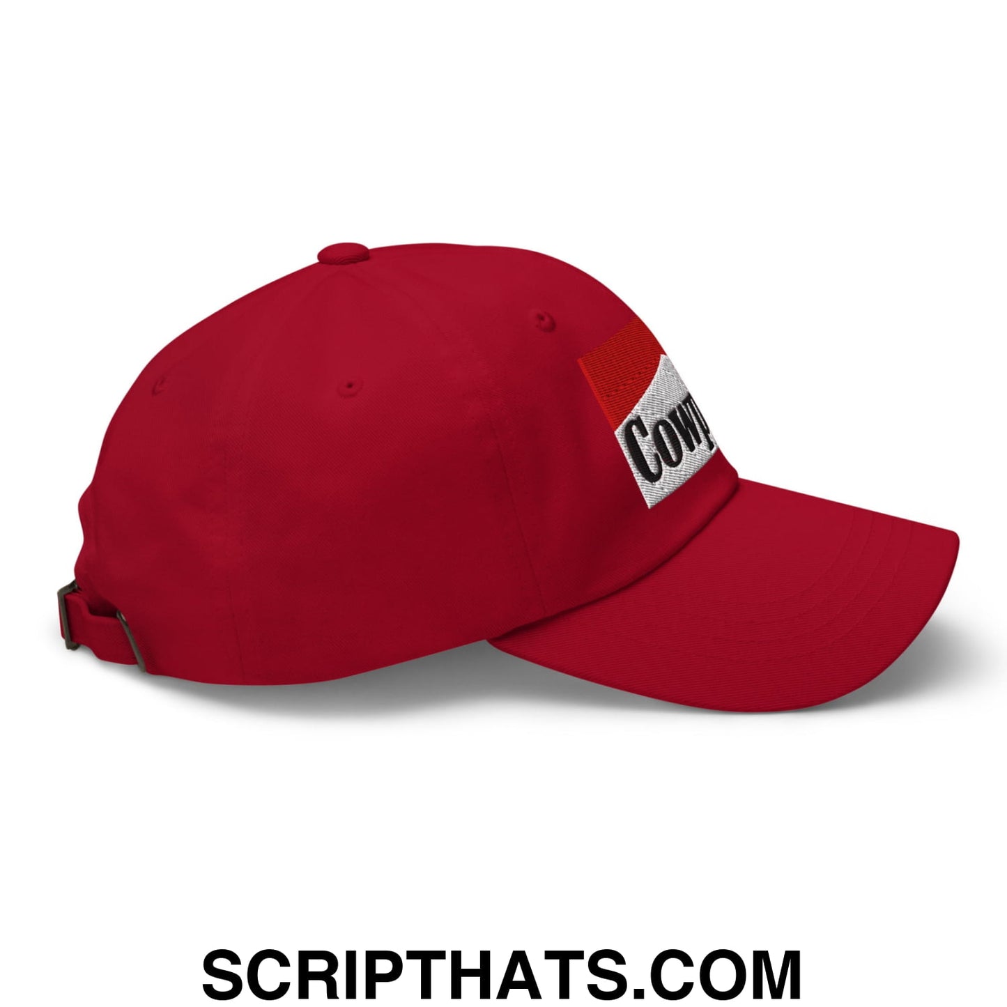 Red cowpoke embroidered unstructured dad hat featuring a white patch with cowboy in black lettering on the side