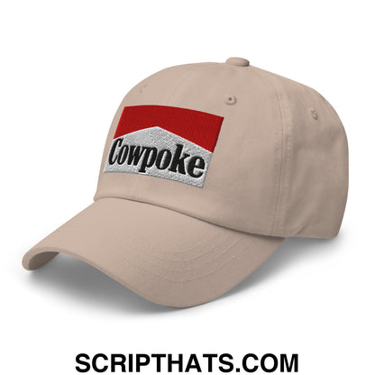 Beige unstructured dad hat with embroidered cowpoke logo in red and silver perfect for casual wear