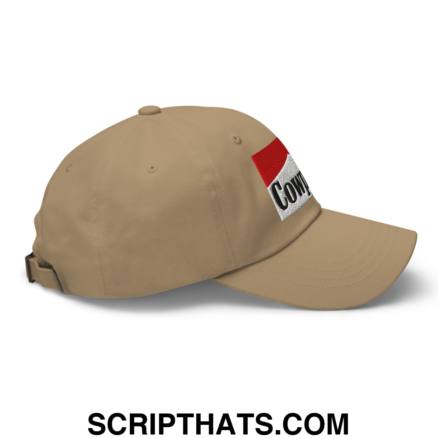 Beige cowpoke embroidered unstructured dad hat featuring a red and white patch with black cow lettering