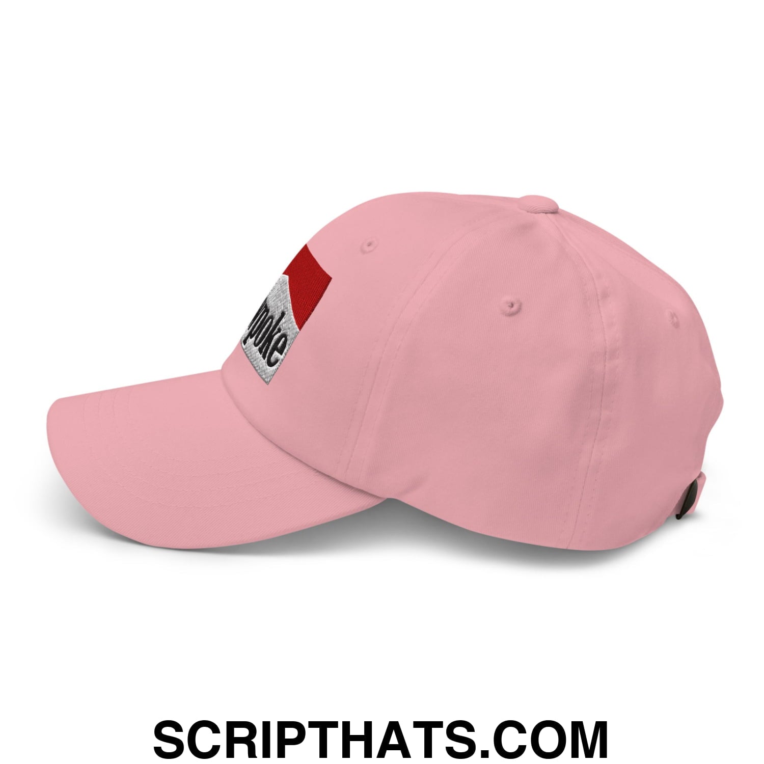 Pink cowpoke embroidered unstructured dad hat with red and silver patch on the side