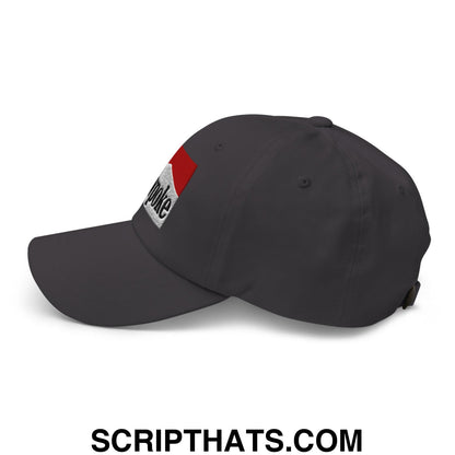 Dark gray unstructured dad hat featuring a red and white embroidered Cowpoke logo on the front