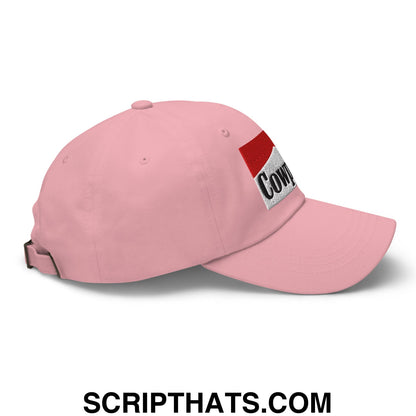 Pink unstructured dad hat with red and white embroidered patch featuring cow in black lettering called cowpoke