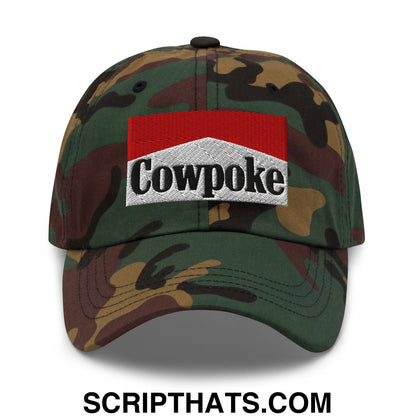 Camouflage baseball cap with a red and white embroidered cowpoke patch in black lettering unstructured dad hat