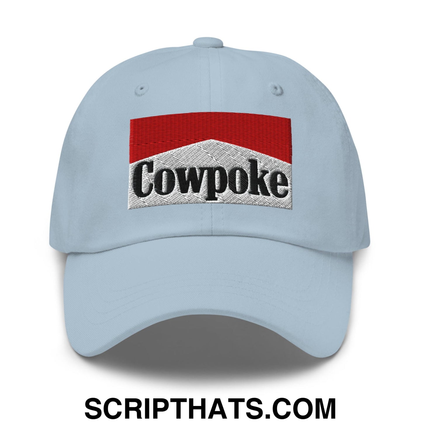 Light blue unstructured dad hat with embroidered red and silver cowpoke logo inspired by Marlboro design