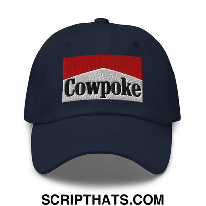 Dark navy unstructured dad hat featuring an embroidered cowpoke logo with red and silver marlboro style design