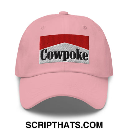 Pink unstructured dad hat featuring an embroidered cowpoke logo with red and silver marlboro-inspired design