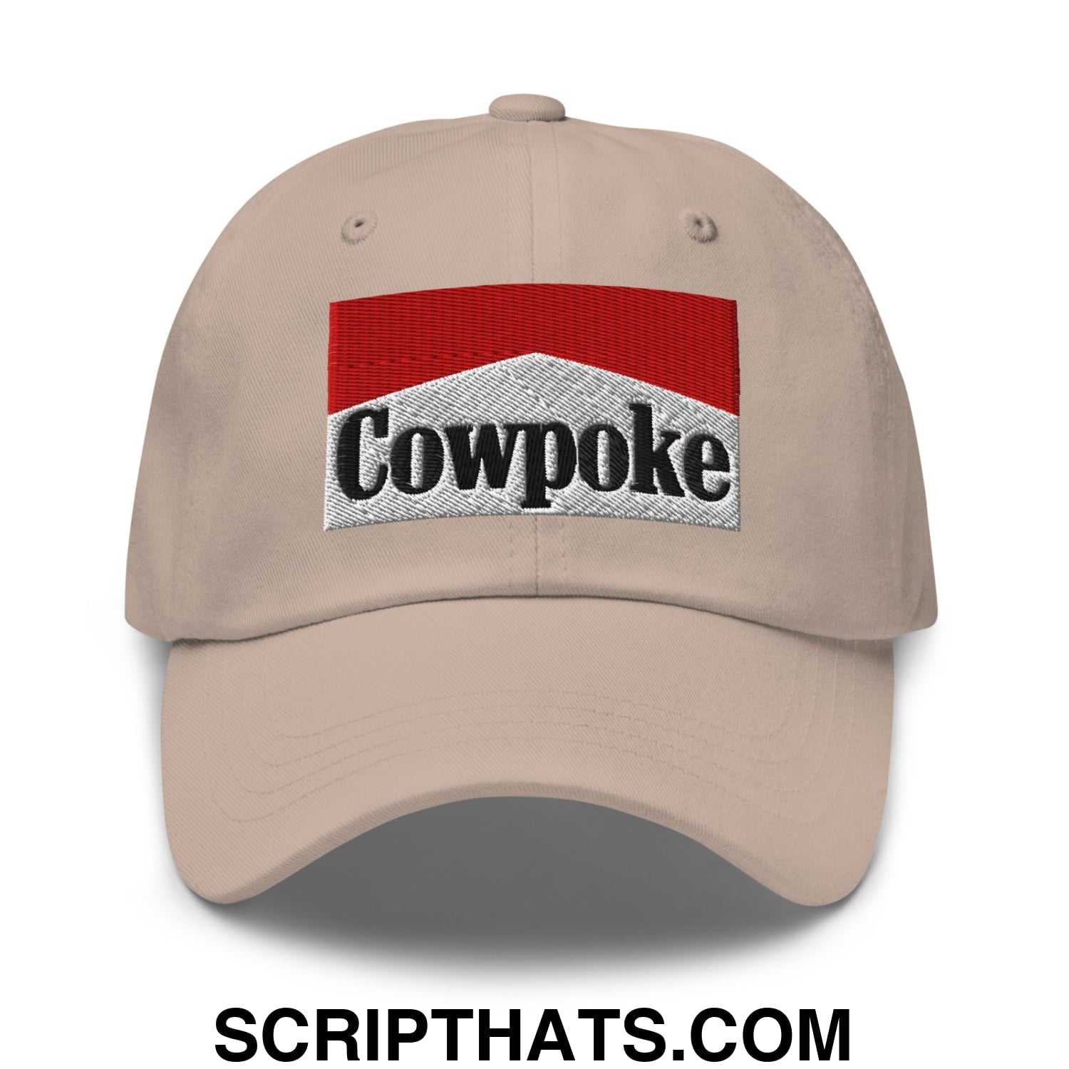 Beige unstructured dad hat with red and silver embroidered cowpoke logo and black lettering baseball cap