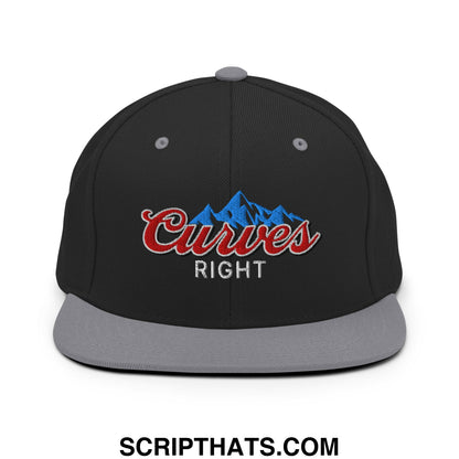 Black snapback cap with gray brim and red curves right embroidered logo over blue mountain design