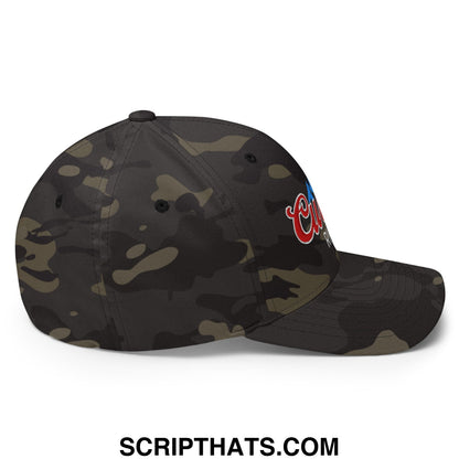 A dark olive and black camouflage stretch fit golf hat with red blue and white embroidered logo on the side