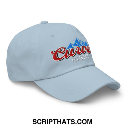 Light blue unstructured golf dad hat with embroidered curve right logo in red script and blue mountain graphic