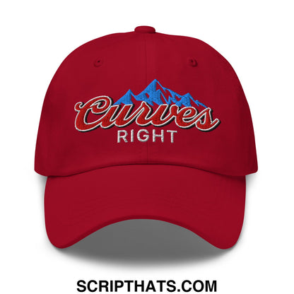 Red unstructured golf dad hat with embroidered curves right logo featuring blue mountain peaks and red script lettering