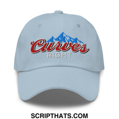 Light blue unstructured golf dad hat with embroidered curves right logo in red script and silver on mountain design