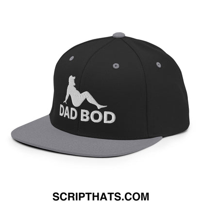 Black and gray snapback hat with white embroidered dad bod silhouette of a woman lounging on flat bill brim