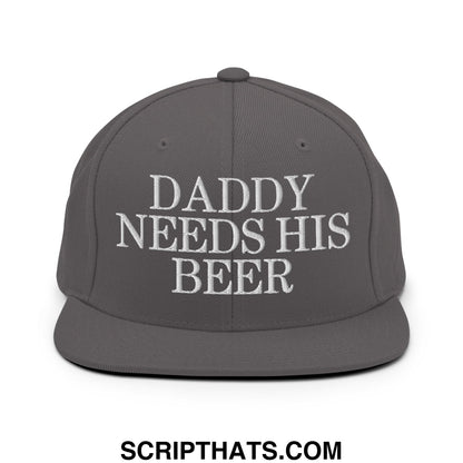 Gray snapback cap with white embroidered daddy needs his beer text and flat bill brim design