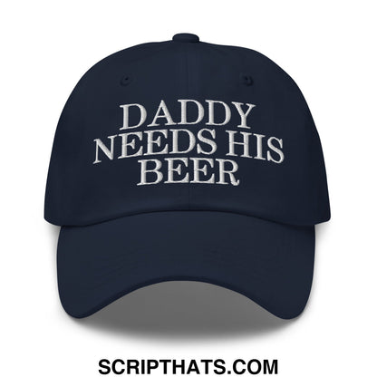Navy blue unstructured dad hat with white embroidered text daddy needs his beer in a casual style