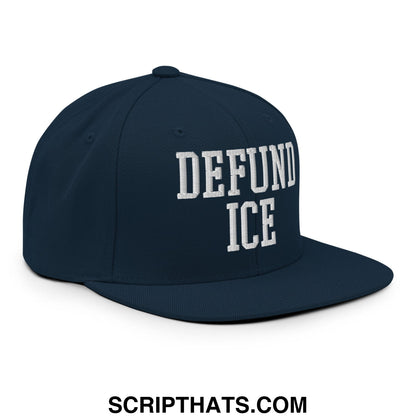 Navy blue snapback hat with white embroidered defund ice text in bold collegiate font and flat bill brim