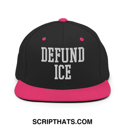 Black snapback cap with vibrant pink brim and button featuring bold white embroidered defund ice text