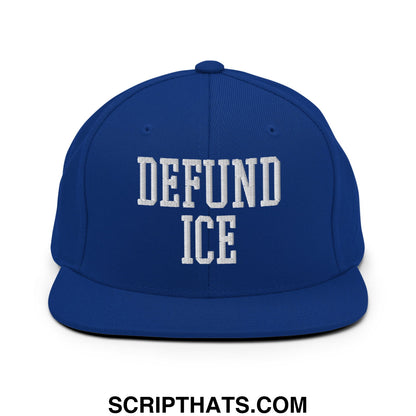 Royal blue snapback hat with white embroidered defund ice text in bold collegiate style flat bill brim design
