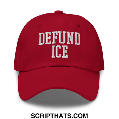 Red unstructured dad hat with white embroidered defund ice text in a classic collegiate font