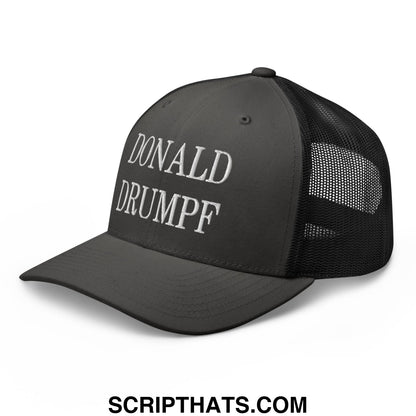 Black embroidered mesh trucker hat with white donald drumpf text on the front panel