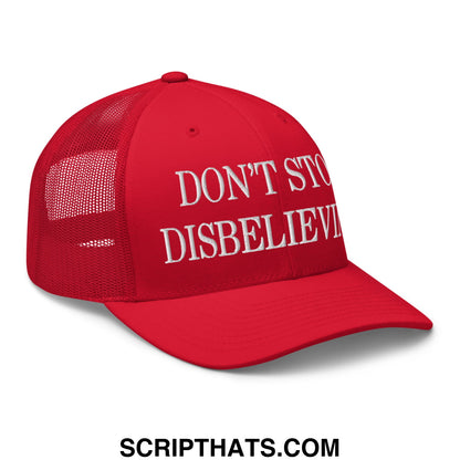 Red mesh trucker hat with white embroidered text dont stop disbelieving on the front panel
