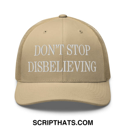 Beige mesh trucker hat with white embroidered text reading dont stop disbelieving on the front panel