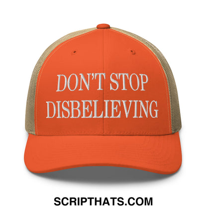 Orange embroidered mesh trucker hat with white text dont stop disbelieving and tan mesh back