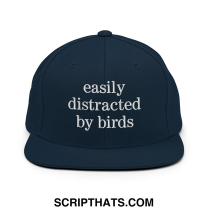 Navy blue snapback hat with white embroidered easily distracted by birds text and flat bill brim