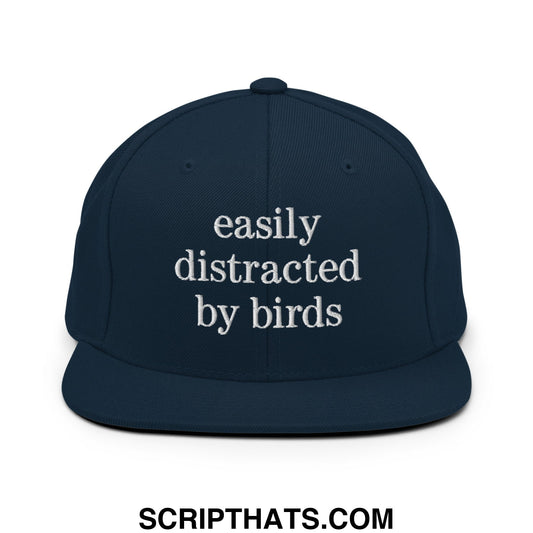 Navy blue snapback hat with white embroidered easily distracted by birds text and flat bill brim