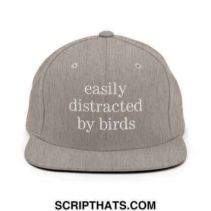 Gray snapback hat with white embroidered easily distracted by birds text and flat bill brim for casual wear