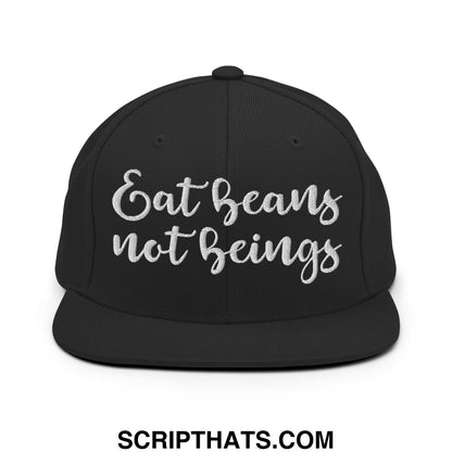 Black snapback hat with silver embroidered eat beans not beings text and a flat bill brim design
