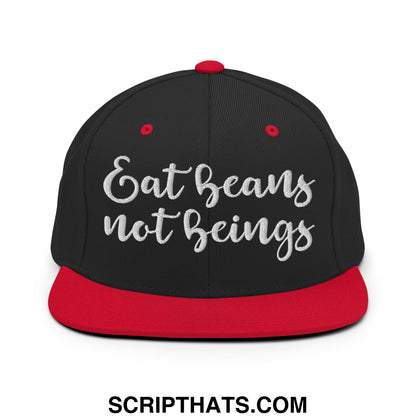 Black snapback cap with red brim and button featuring silver embroidered eat beans not beings text on front