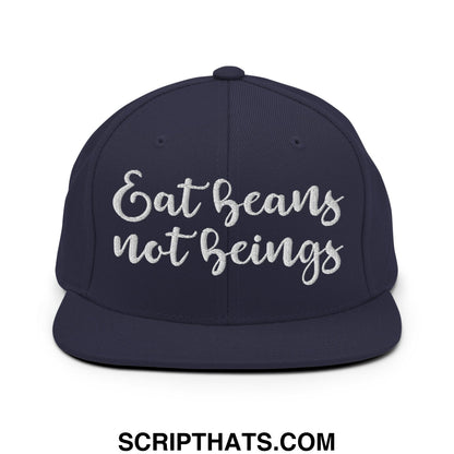 Navy blue snapback hat with white embroidered eat beans not beings script and a flat bill brim design