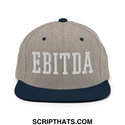 Gray and navy blue snapback hat with ebitda embroidered in white on the flat bill brim front panel
