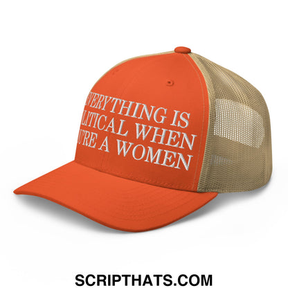 Orange and tan mesh trucker hat with white embroidered text everything is political when youre a women