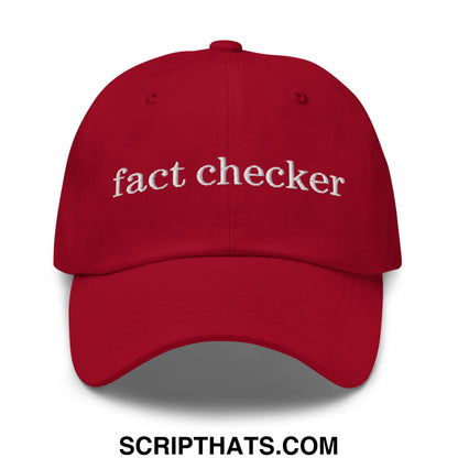 Red unstructured dad hat with white embroidered fact checker text perfect for casual wear